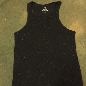A black running tank with white speckles on it.